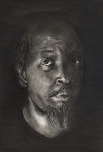A detailed charcoal portrait of a man