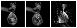 A series of three black and white images of a woman trapped in a plastic bag of water, which bursts in the final image