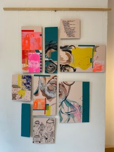 A mixed media portrait painting of a man with glasses and a beard. The portrait is broken up into four separate panels with five other panels with abstract paint markings in green, pink, red and yellow, written text, old photographs and illustrations.  