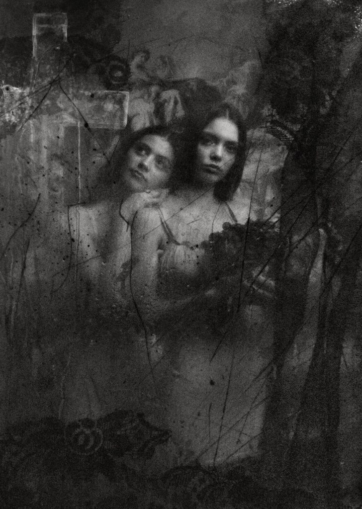 A black and white photography of two young women. One is looking towards the camera holding a bunch of flowers,  the other is resting on the woman's shoulder looking dreamily up. 
The photography has been overlaid with different textures, like lace and scratches. 