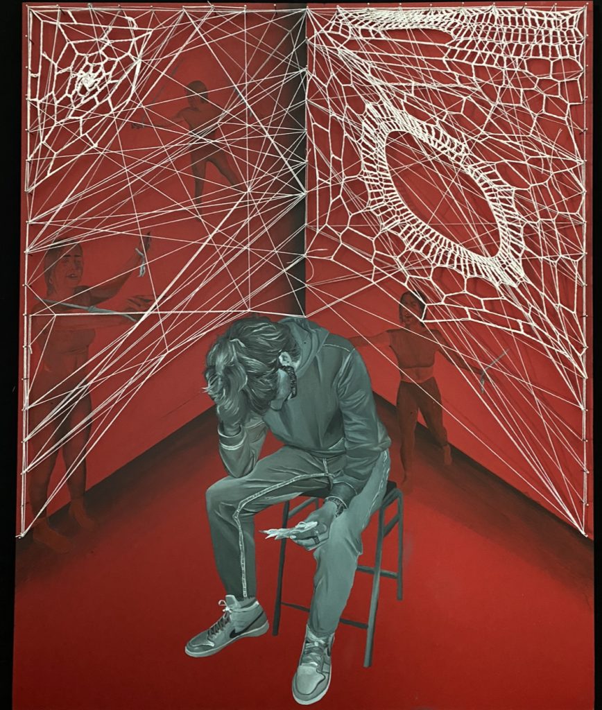 A painting of man sitting on stool, he is holding his head in one hand and holding a note in the other. 
Behind him are multiple people trying to reach for him but they are tied with string. Over the figures the artist has tied a web string over the top of the people. 